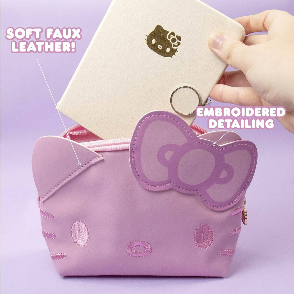 Pink Hello Kitty mini pouch with embroidered details and gold keychain ring
