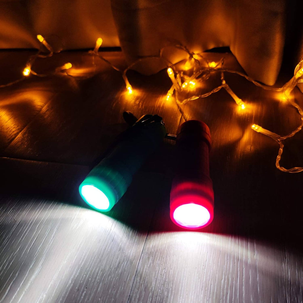 LED mini flashlights shining bright beams, turquoise and red
