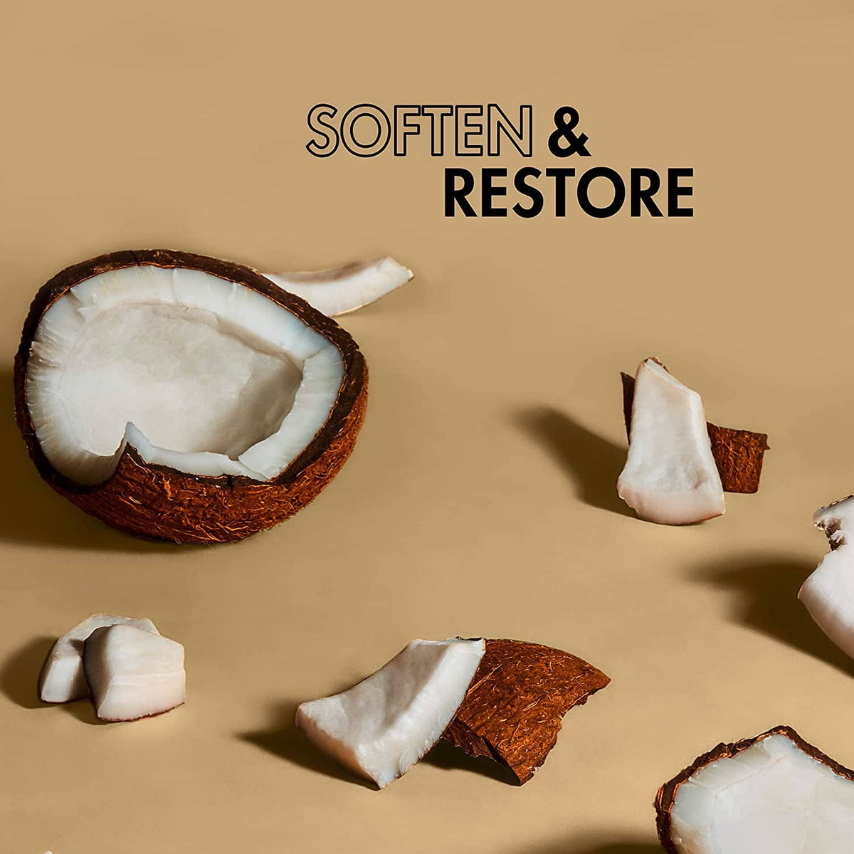 Softens and restores body oil concept with coconut shell and white coconut pieces