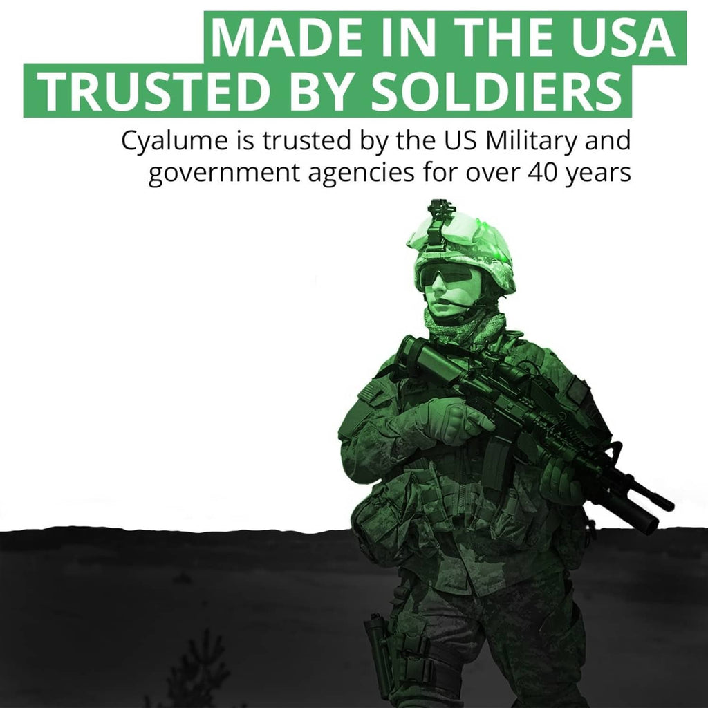 Soldier holding a green glow stick, handheld signaling safety light