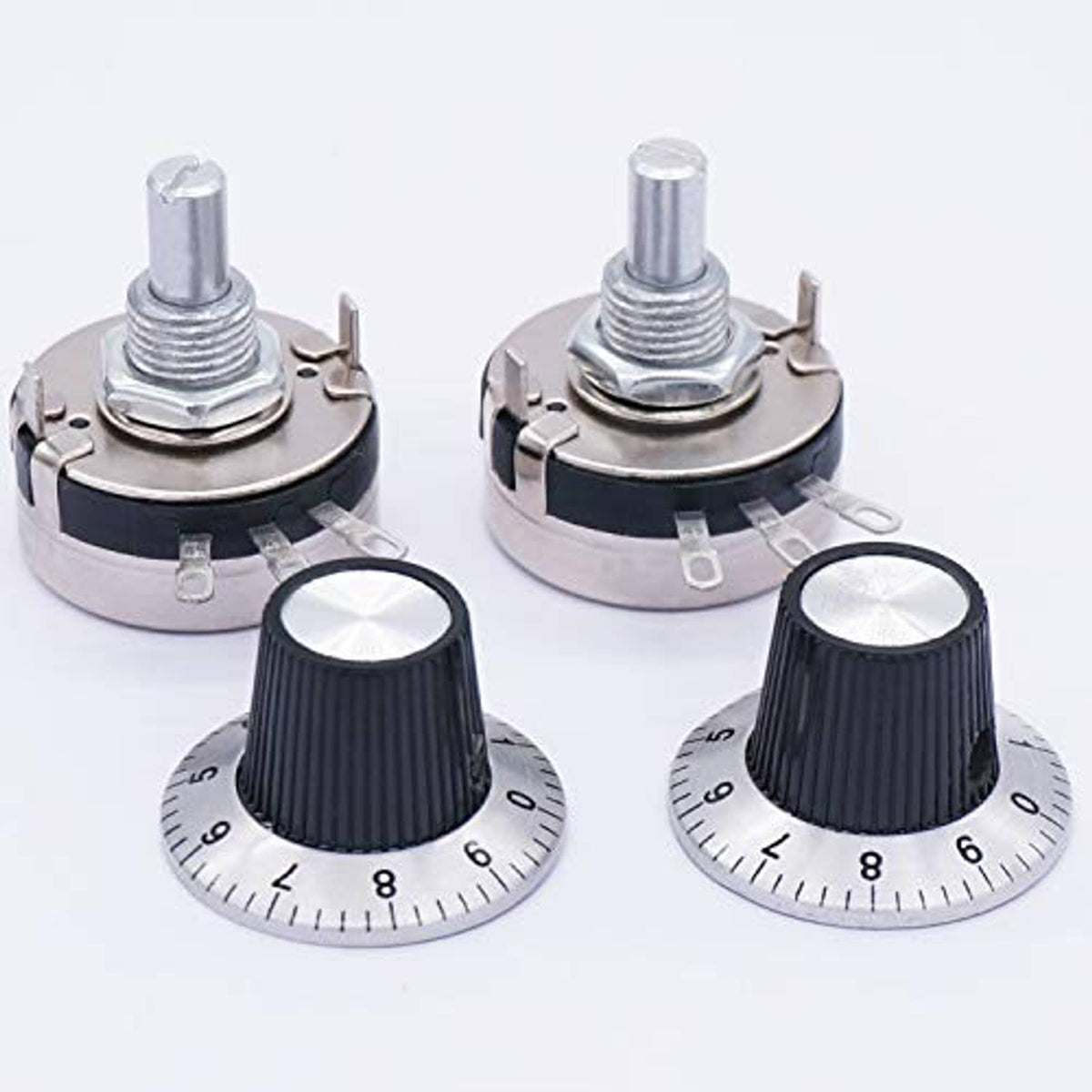 Four views of rotary potentiometers: black knobs, silver housings, and metal pins