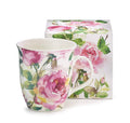 Porcelain mug with white base and pink rose floral design, green leaves, curved handle