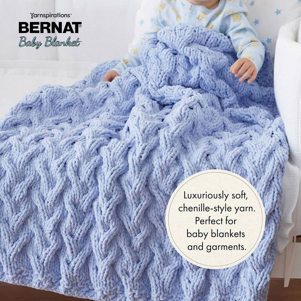 Chunky knit baby blanket in light blue with raised cable-style pattern