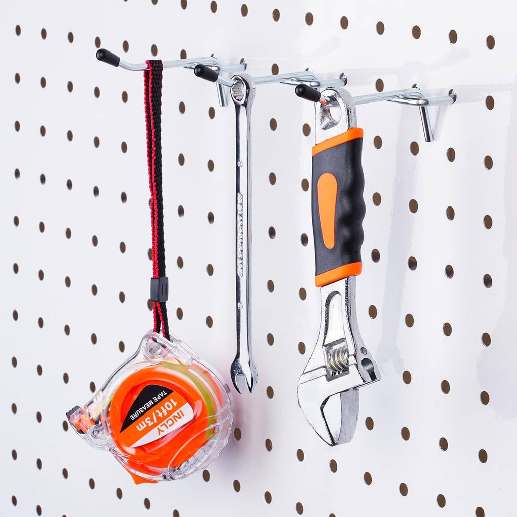 Steel pegboard hook set holding tools on a pegboard grid