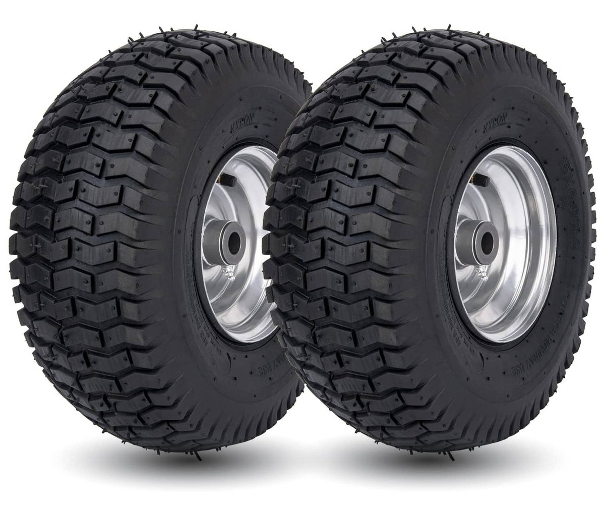 Pair of black lawn mower tires with silver wheel rims and deep tread pattern