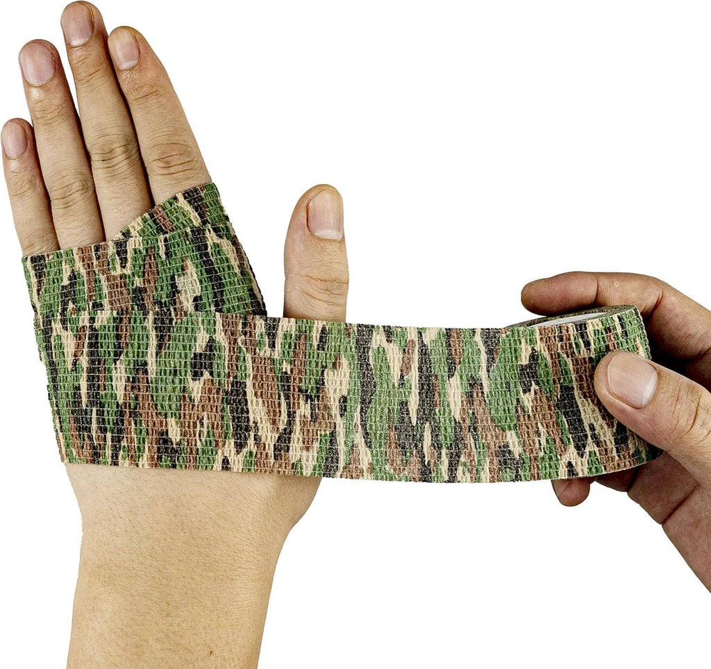 Camouflage elastic athletic tape wrapped across hands, self-adhesive cohesive band strip.