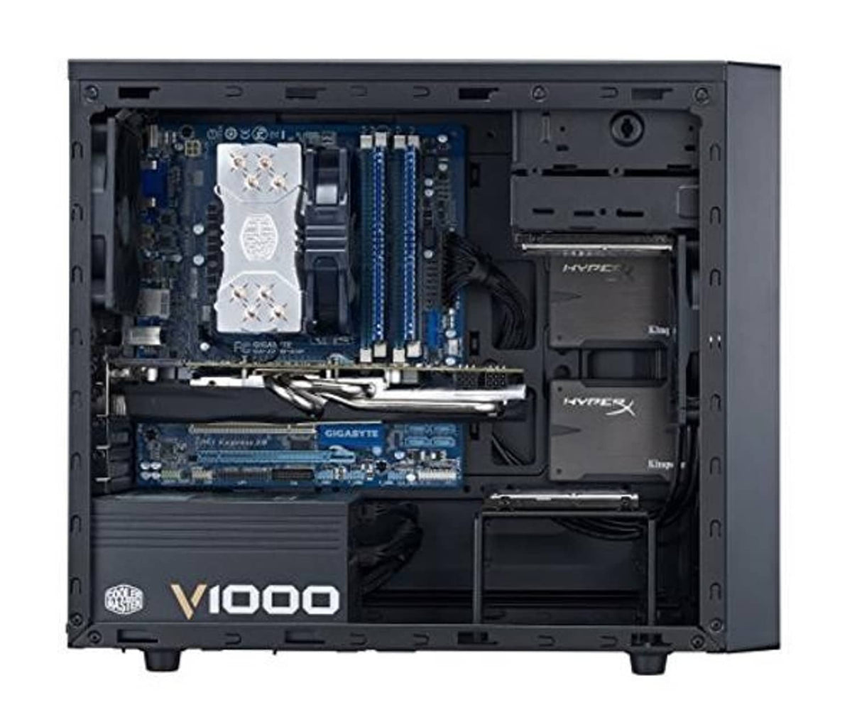 Open mini tower PC case showing motherboard, RAM slots, and installed GPU