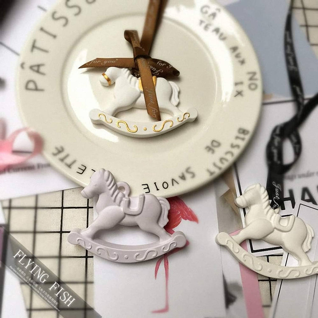 Rocking horse candy pieces arranged on a plate for decoration.