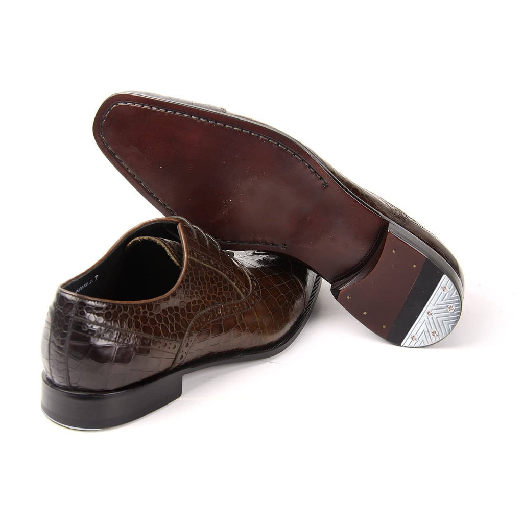 Brown dress shoes with attached metal heel plates on heel taps