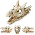 White dragon skull ornament with open jaw, winged ribs, and detailed teeth