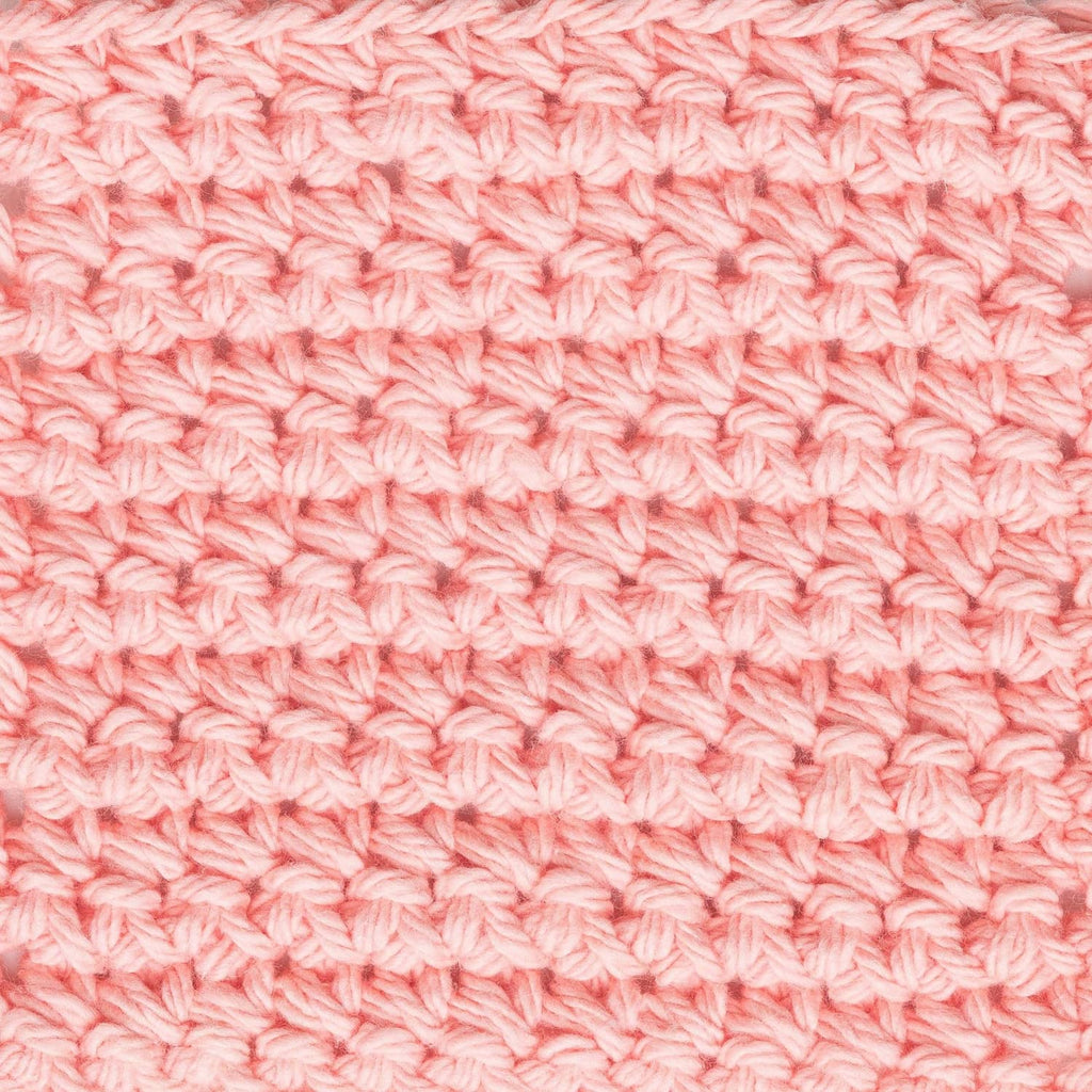 Light pink crochet stitch fabric swatch with repeating loop pattern