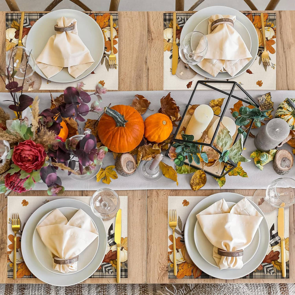 Set of beige fall placemats with pumpkin, leaves, and wheat illustrations