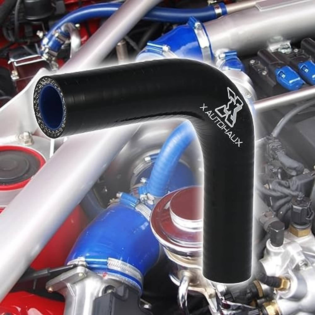 Black 90-degree elbow hose reducer with blue inner ports in engine bay