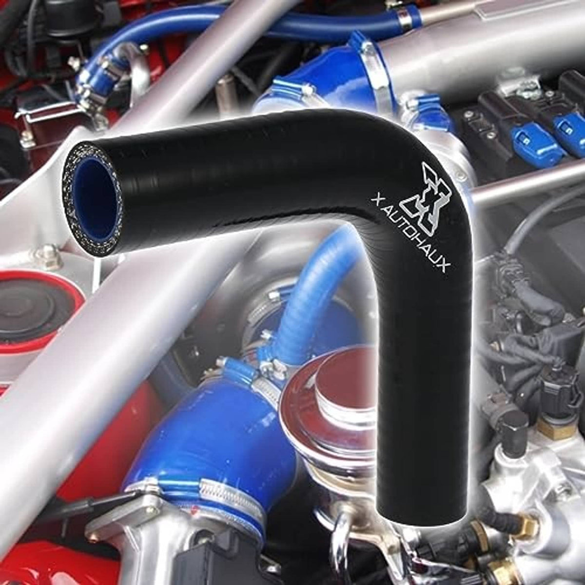 Black 90-degree elbow hose reducer with blue inner ports in engine bay