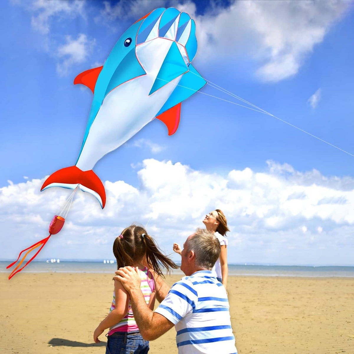Blue 3D dolphin kite with red tail and white belly, diamond sail detail and string