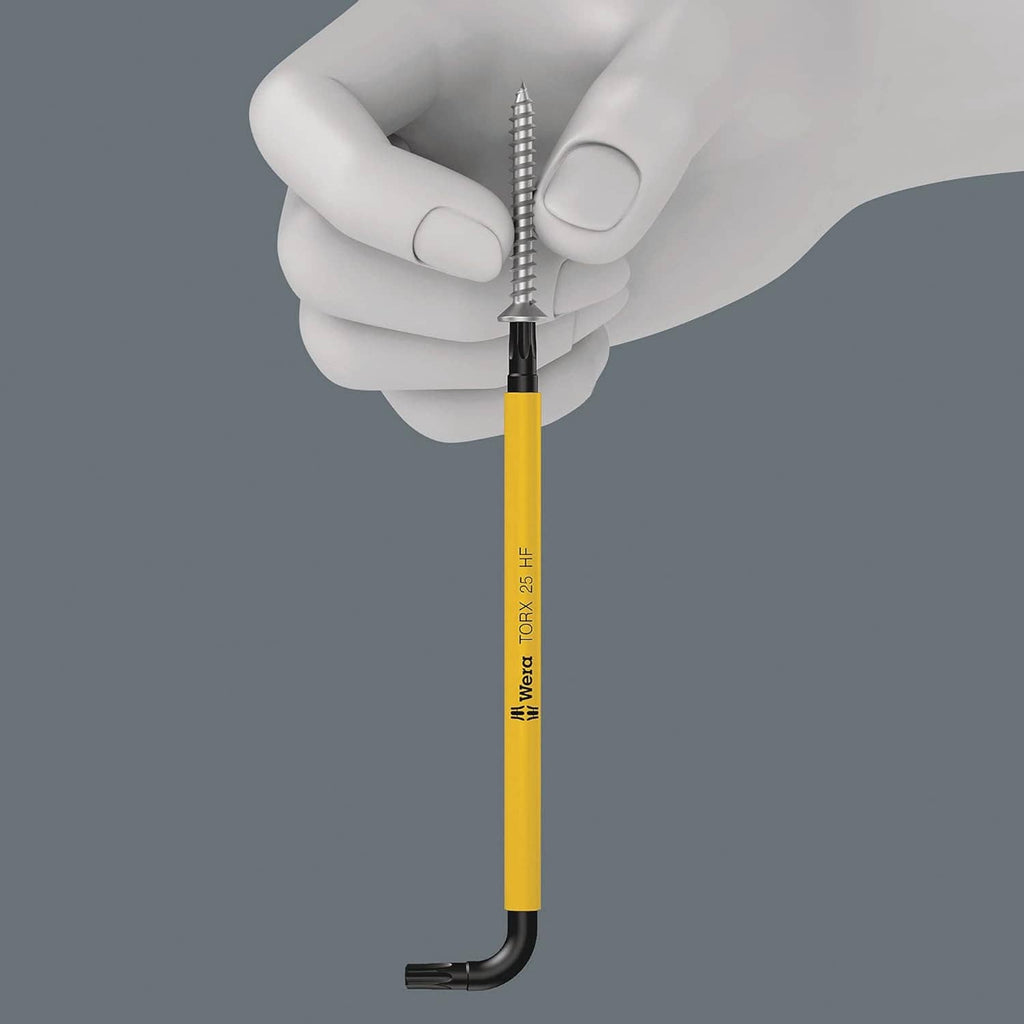 Torx L-key with yellow shaft held by white-gloved hand