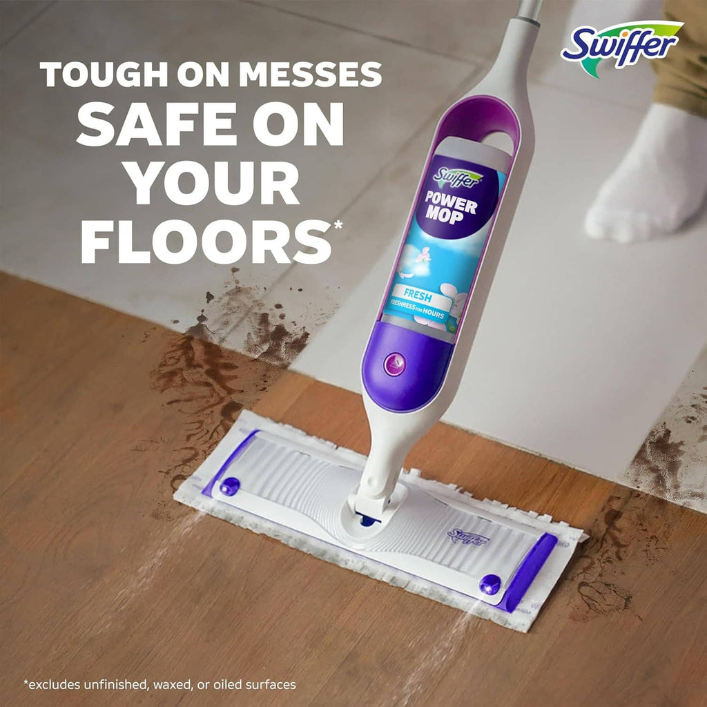 Swiffer Power Mop with cleaning bottle and mop pad on hardwood floor
