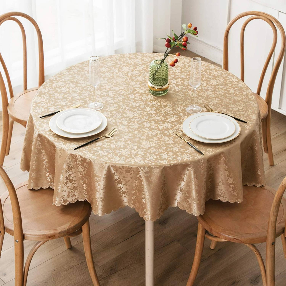 Round beige floral waterproof vinyl tablecloth with scalloped hem and full table drape