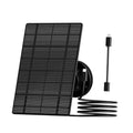 Black solar panel kit with wall mount and coiled power cable for outdoor camera
