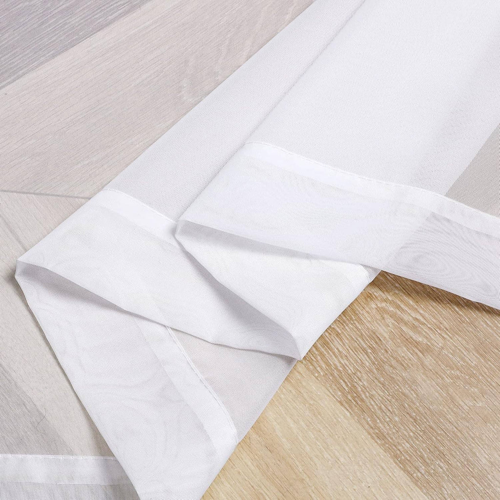 White sheer curtain fabric panels, neatly folded with soft, translucent look