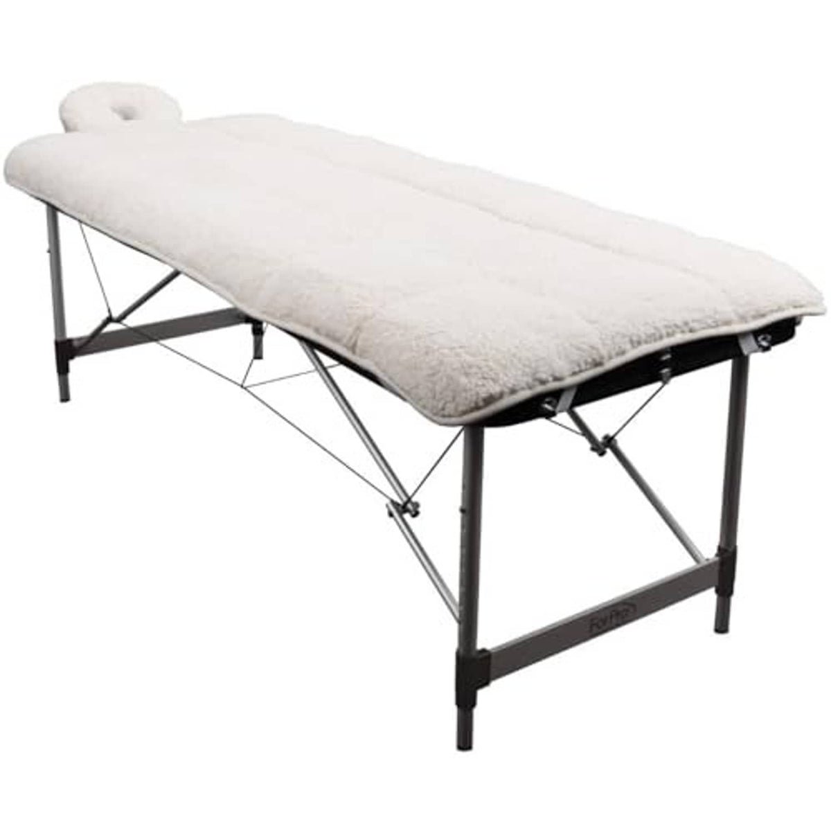 Natural quilted fleece table pad set laid over massage table, thick cushioned top.