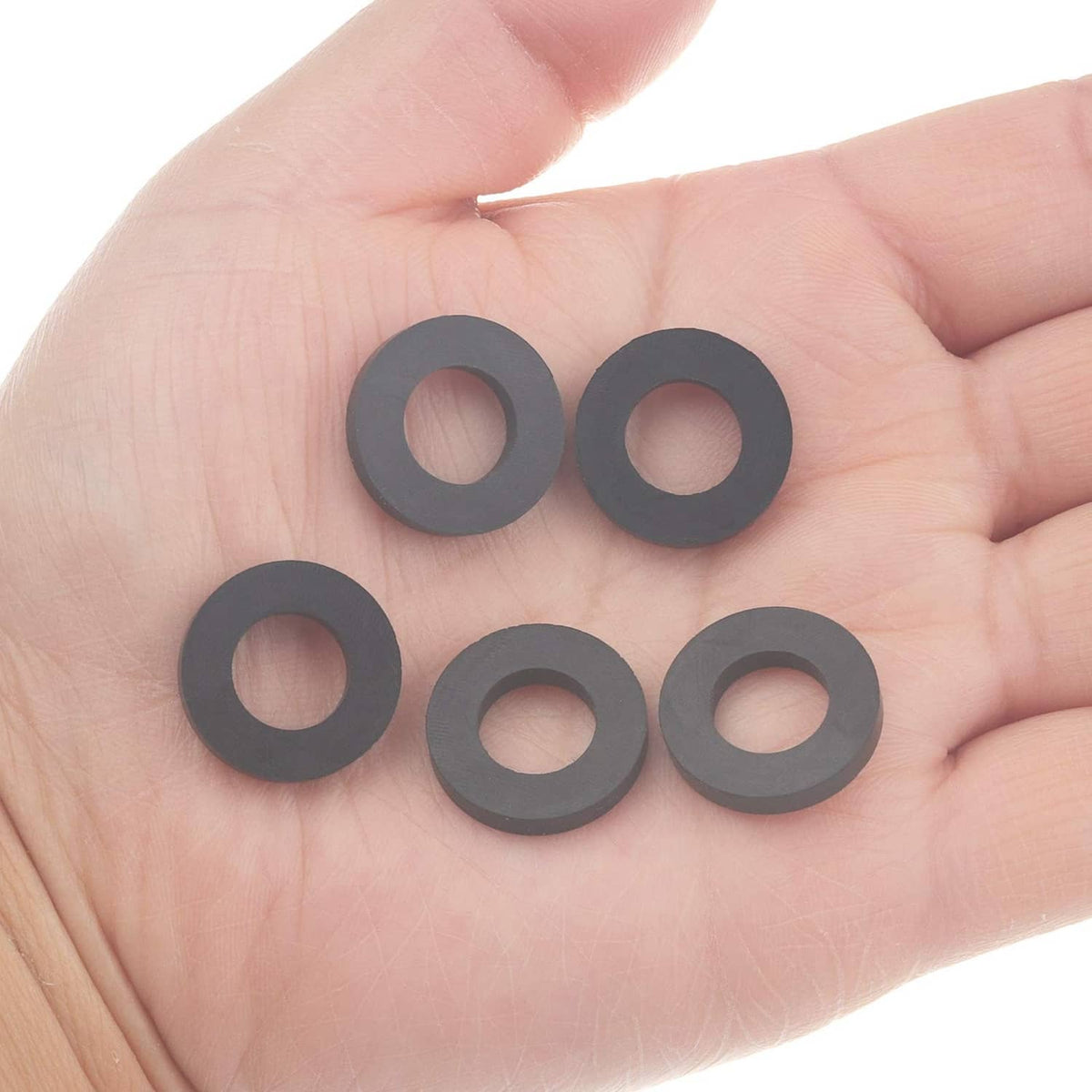 Black O-ring gasket set shown in hand, small round rubber washers