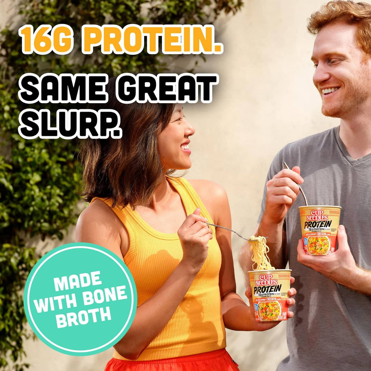 Cup noodles Protein ramen cup held by person with 16g protein on packaging