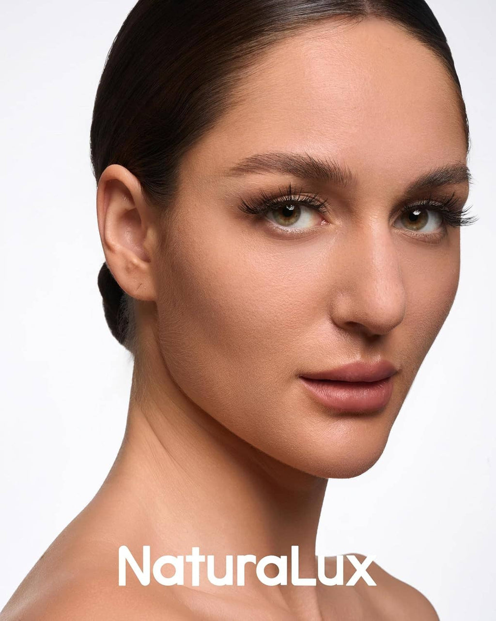 Model wearing wispy false eyelashes with defined lash line