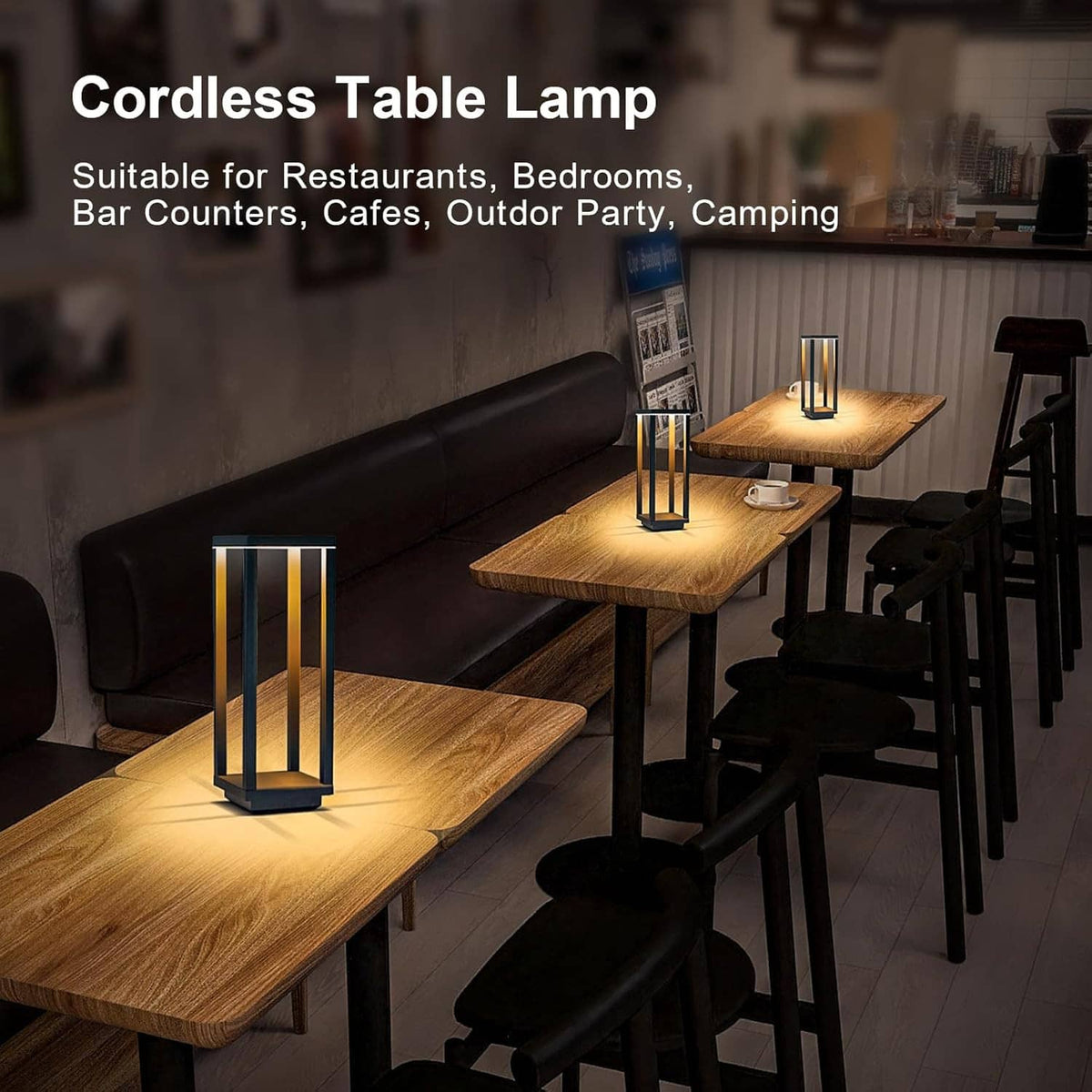 Cordless lantern table lamps in black with warm LED glow on cafe-height wooden tables