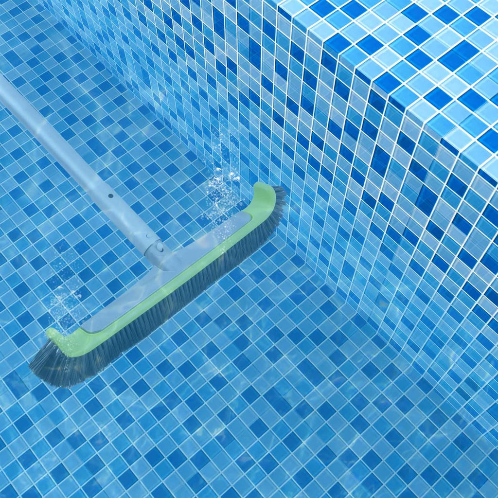 Pool wall scrub brush with black bristles contacting blue tiled pool surface