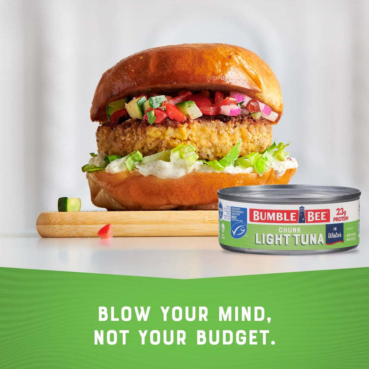 Bumble Bee chunk light tuna can next to sandwich on a plate