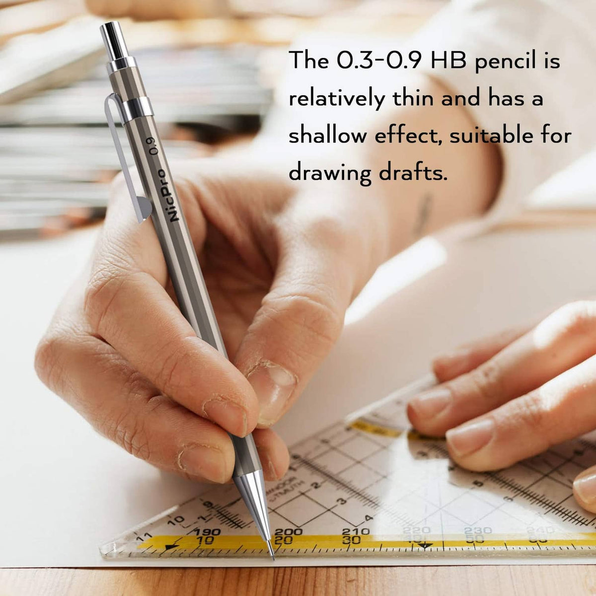 Copper mechanical pencil held for drawing over a ruler