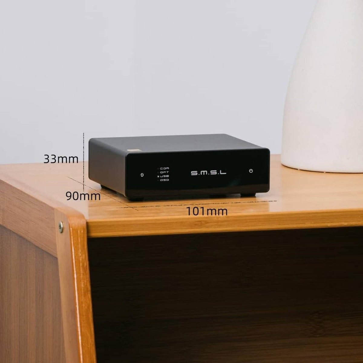 Compact black SMSL USB DAC with size labels 33mm and 101mm on stand