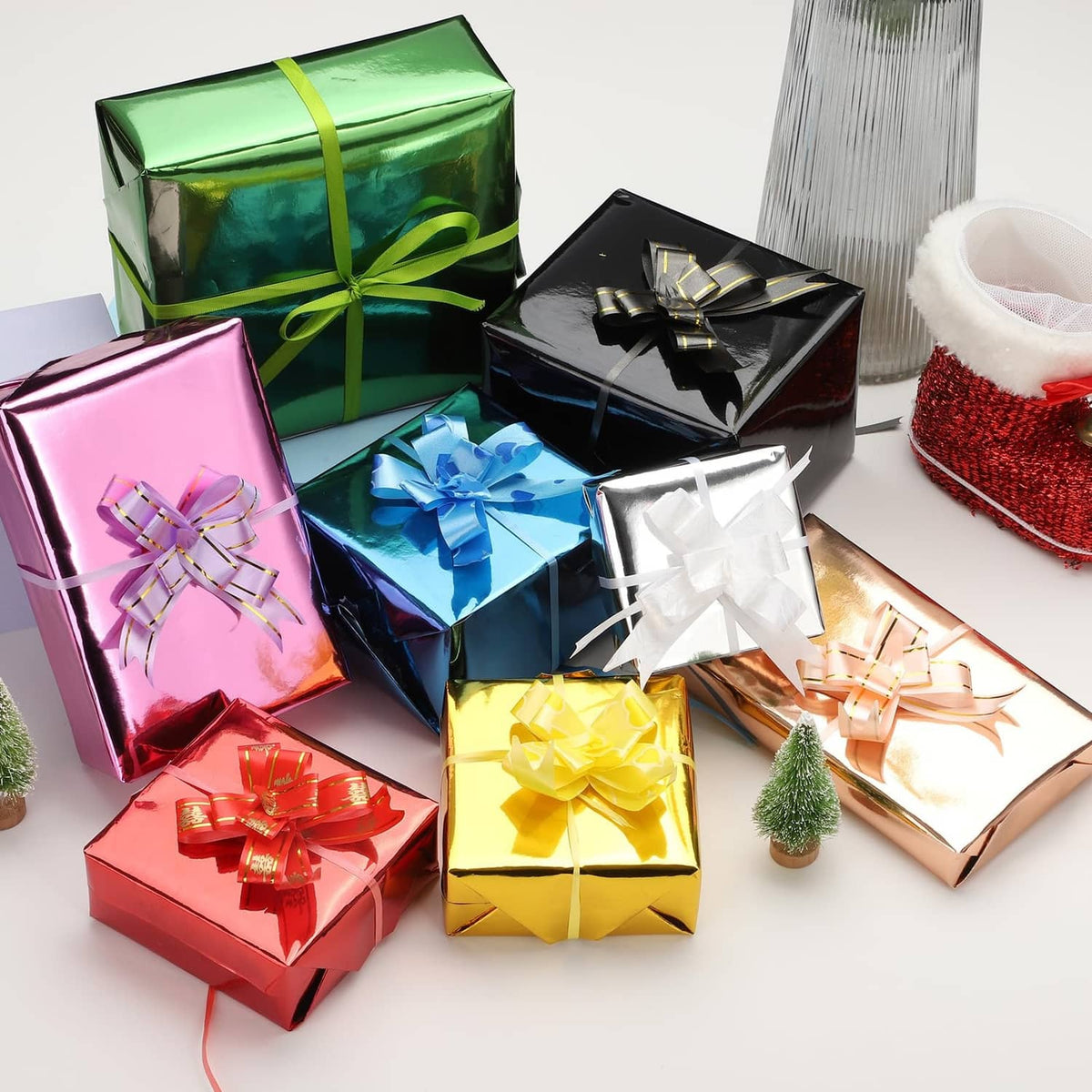 Metallic-style gift wrapping with gold-tone bow and ribbon on present boxes