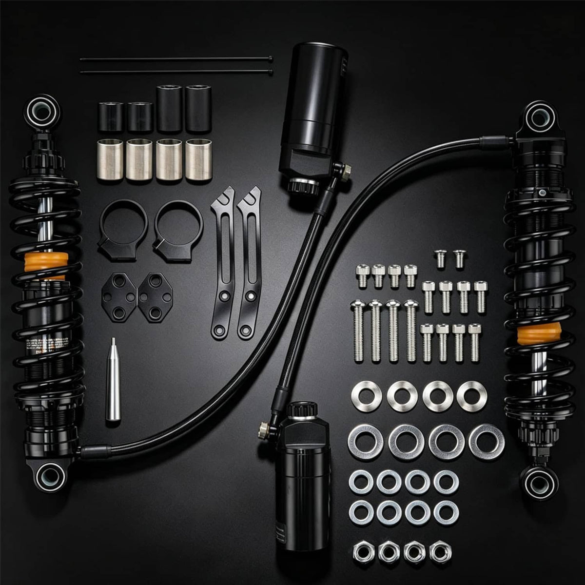 Black suspension shock kit with remote reservoirs, coil springs, and washers