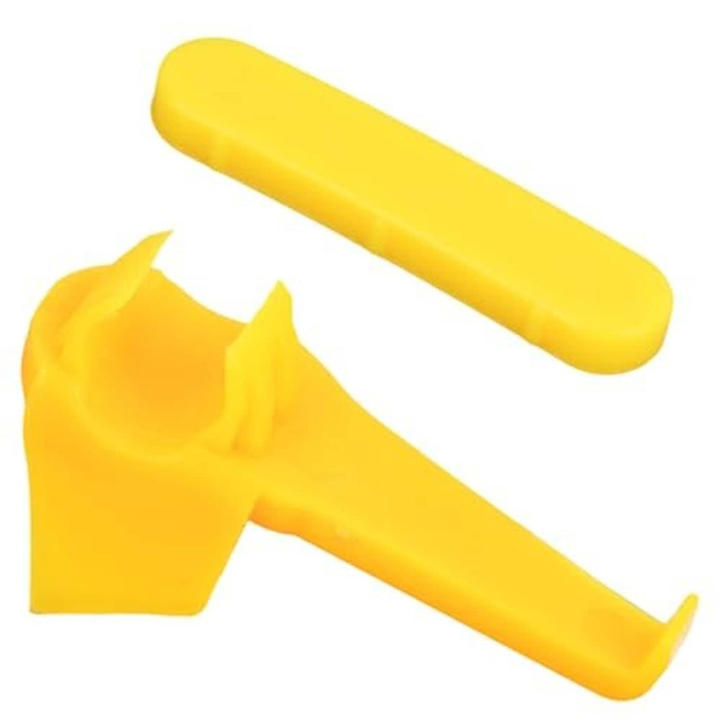 Yellow plastic duck-head tire changer rim protector insert pieces, close-up