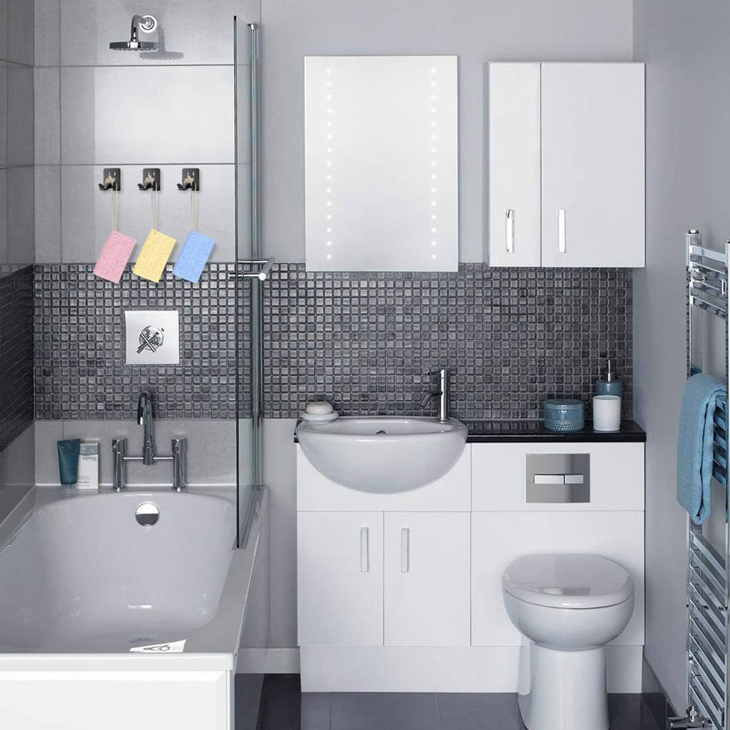 Set of exfoliating bath sponges displayed on a shower wall