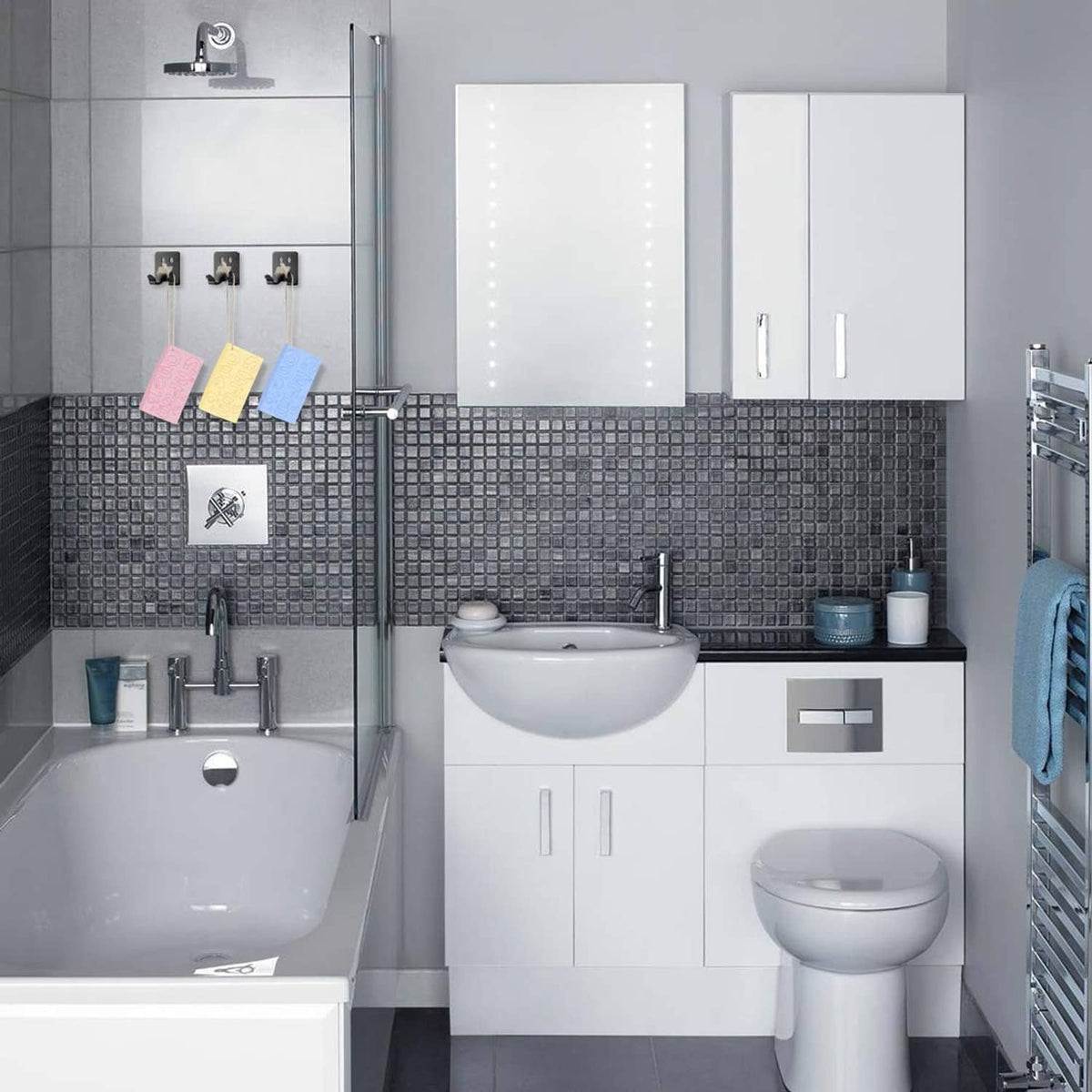 Set of exfoliating bath sponges displayed on a shower wall