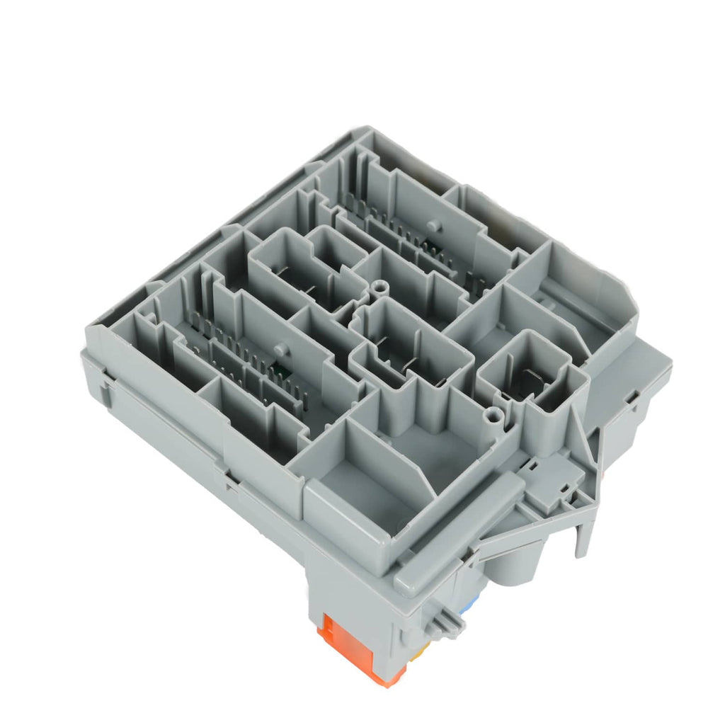 Gray fuse and connector housing with open compartments and pin terminals