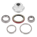 Trailer bearing kit with metal roller bearings, grease seal, and oil cap