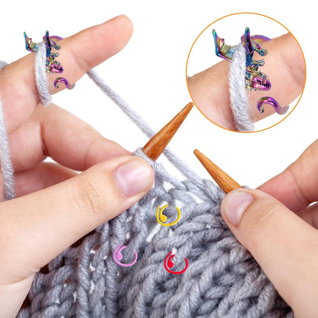Rainbow dragon crochet tension ring on fingers with gray yarn crochet stitches