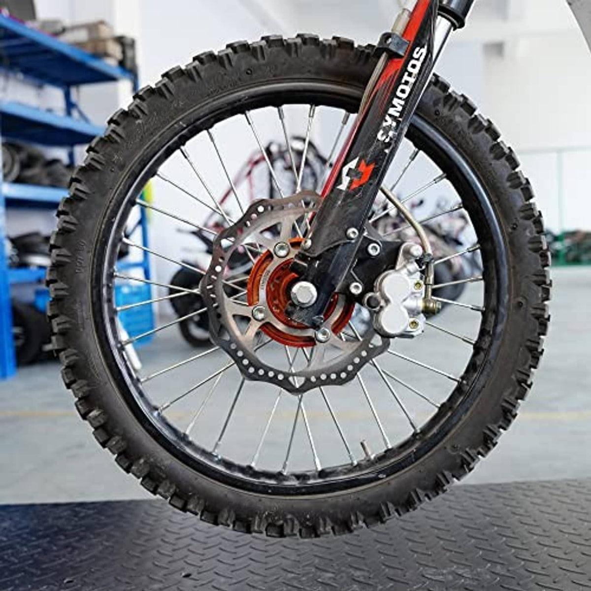 Black inner tube on off-road bike wheel with valve stem visible near the rim