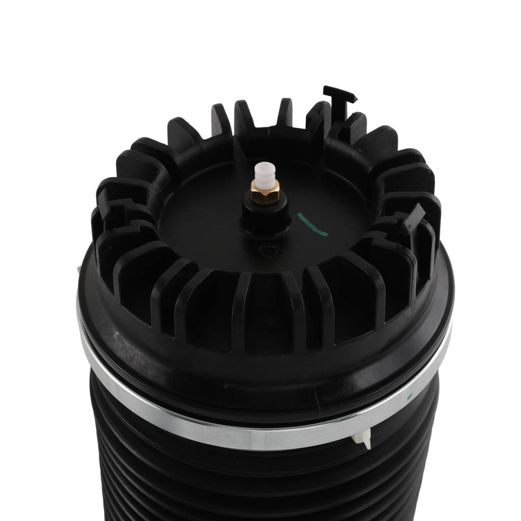 Close-up air suspension strut top with valve fitting and black ribbed housing
