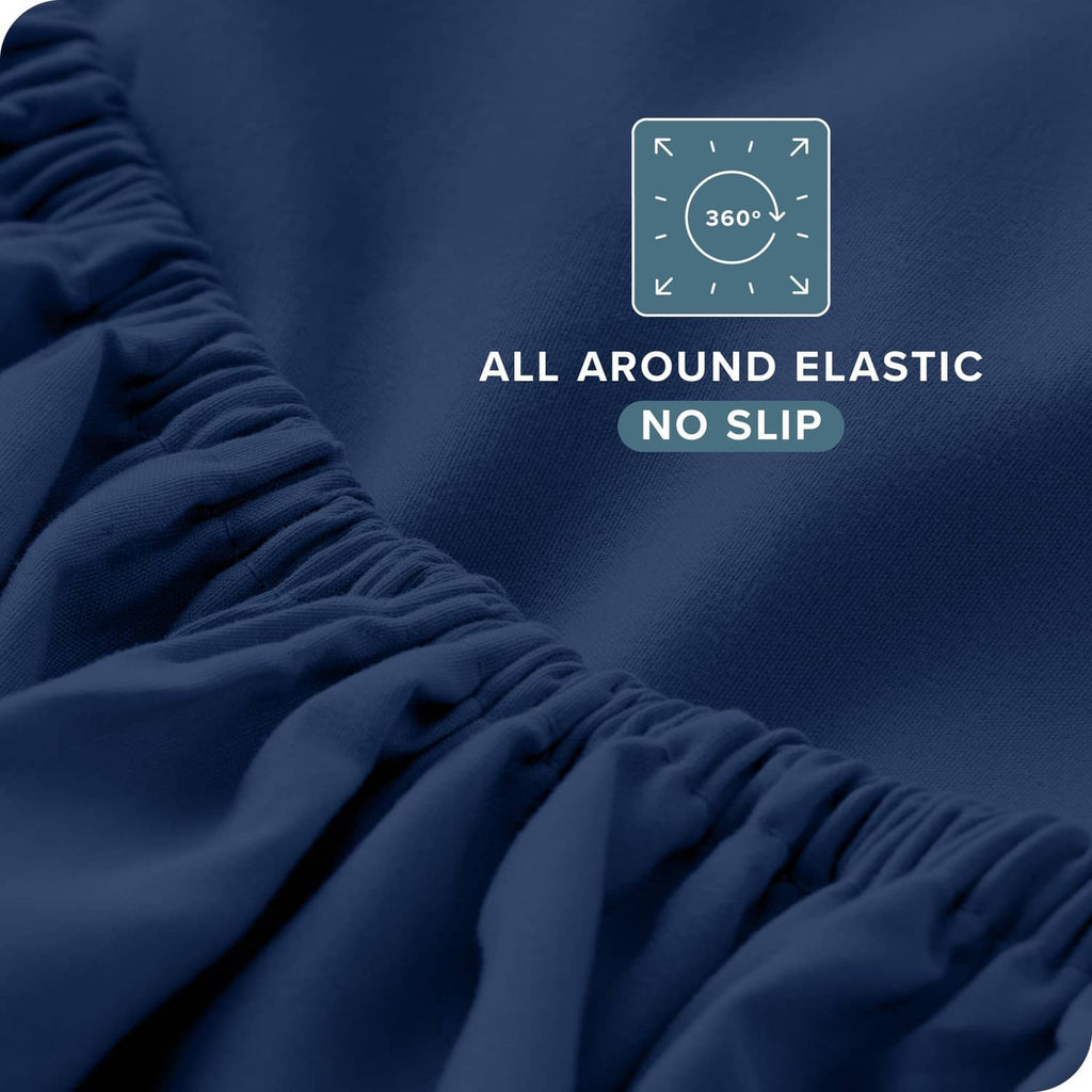 Dark blue fitted sheet with elastic edge detail, close-up fabric ruffles