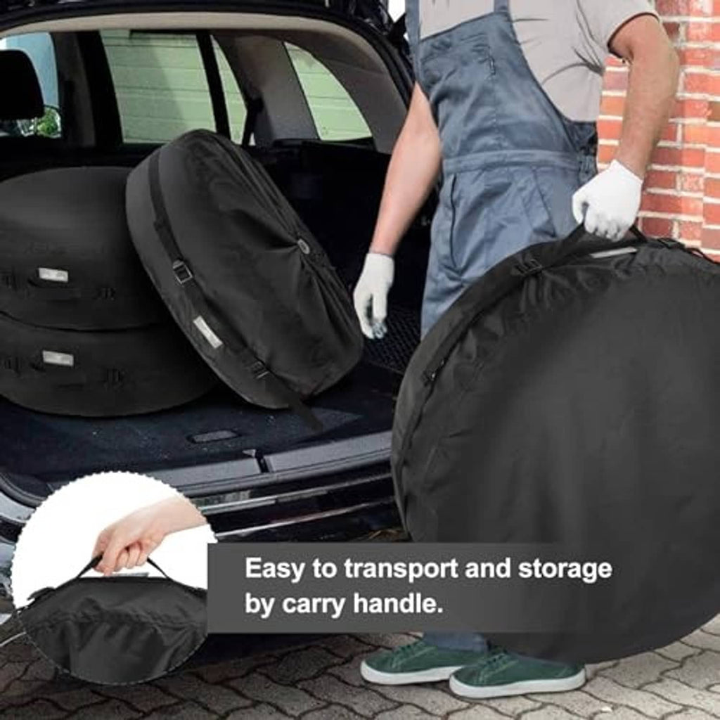 Black spare tire cover in storage with carry handle and adjustable strap buckles