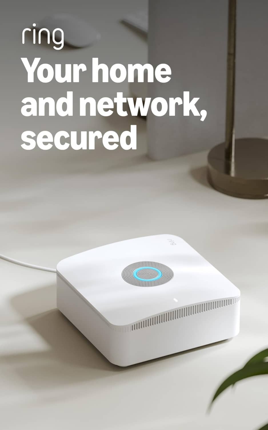 White base station with glowing ring indicator on tabletop