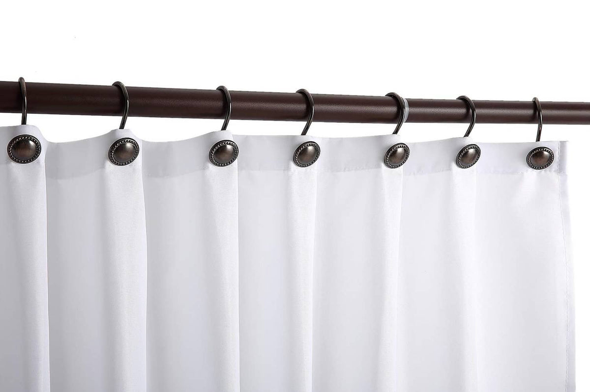 Oil-rubbed bronze shower curtain hooks attached to a rod above white curtains