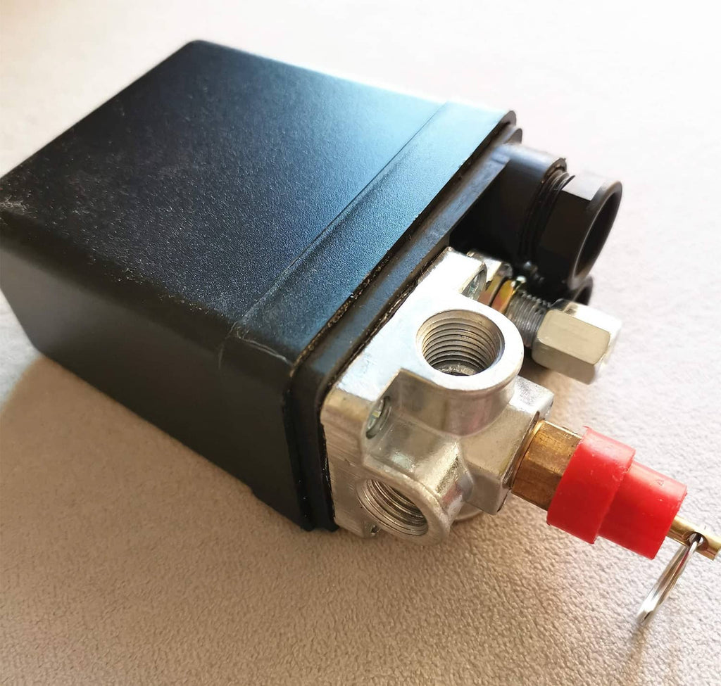 Black valve housing with brass port, red quick-connect fitting, and metal mounting point
