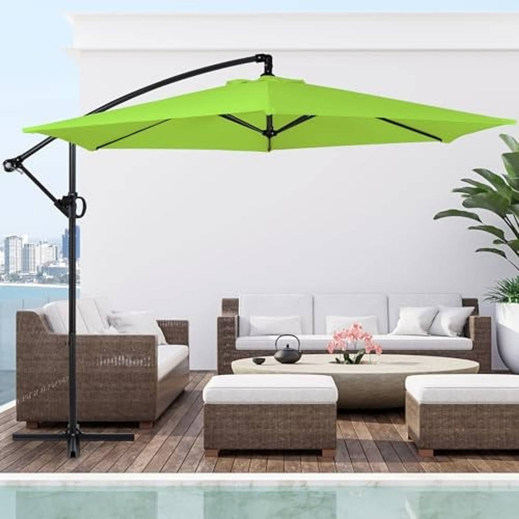 Olive offset patio umbrella over outdoor seating with cross base on wooden deck
