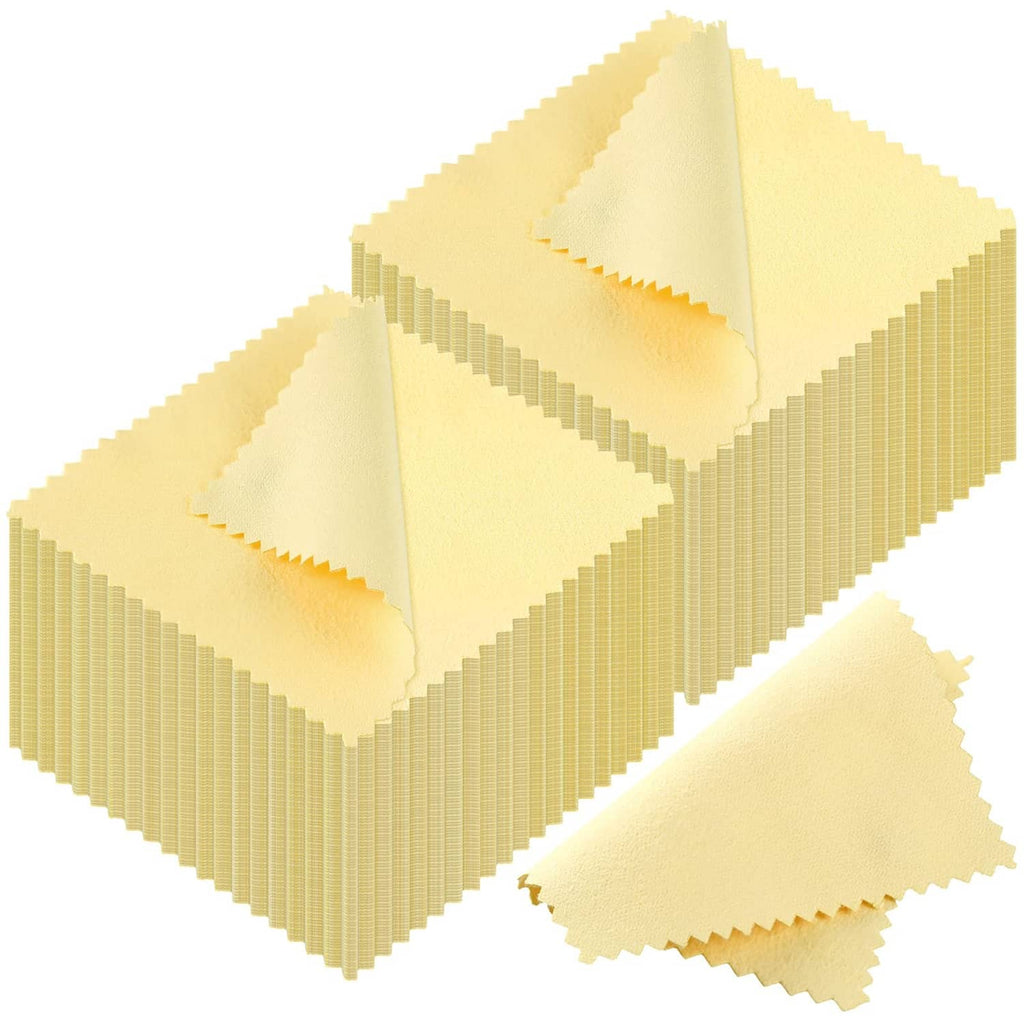 Pack of yellow jewelry cleaning cloth squares with zigzag edges